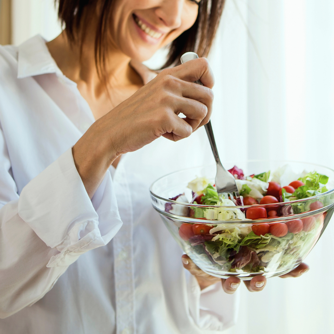 woman heating healthy salad