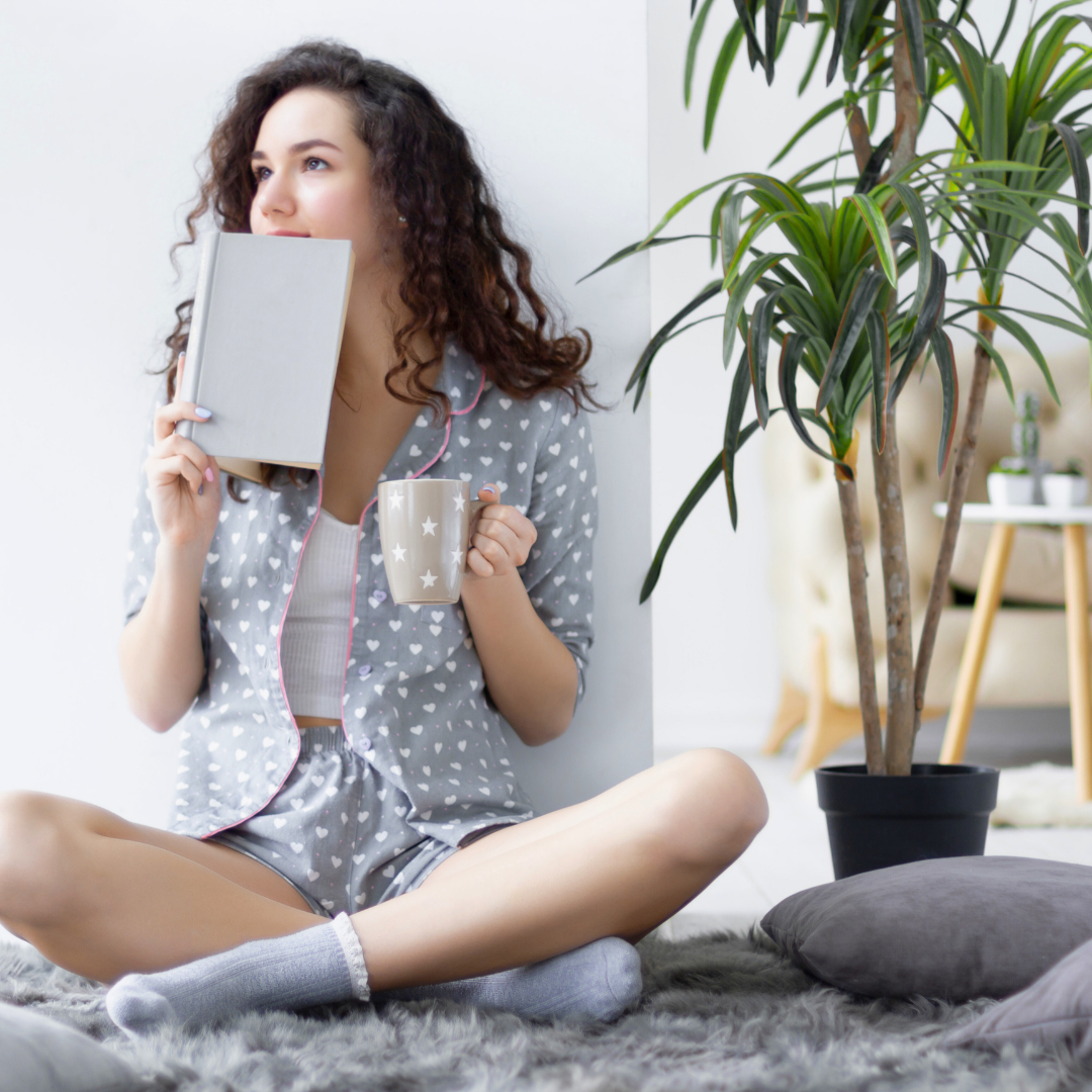 woman enjoying journaling and tea in the morning