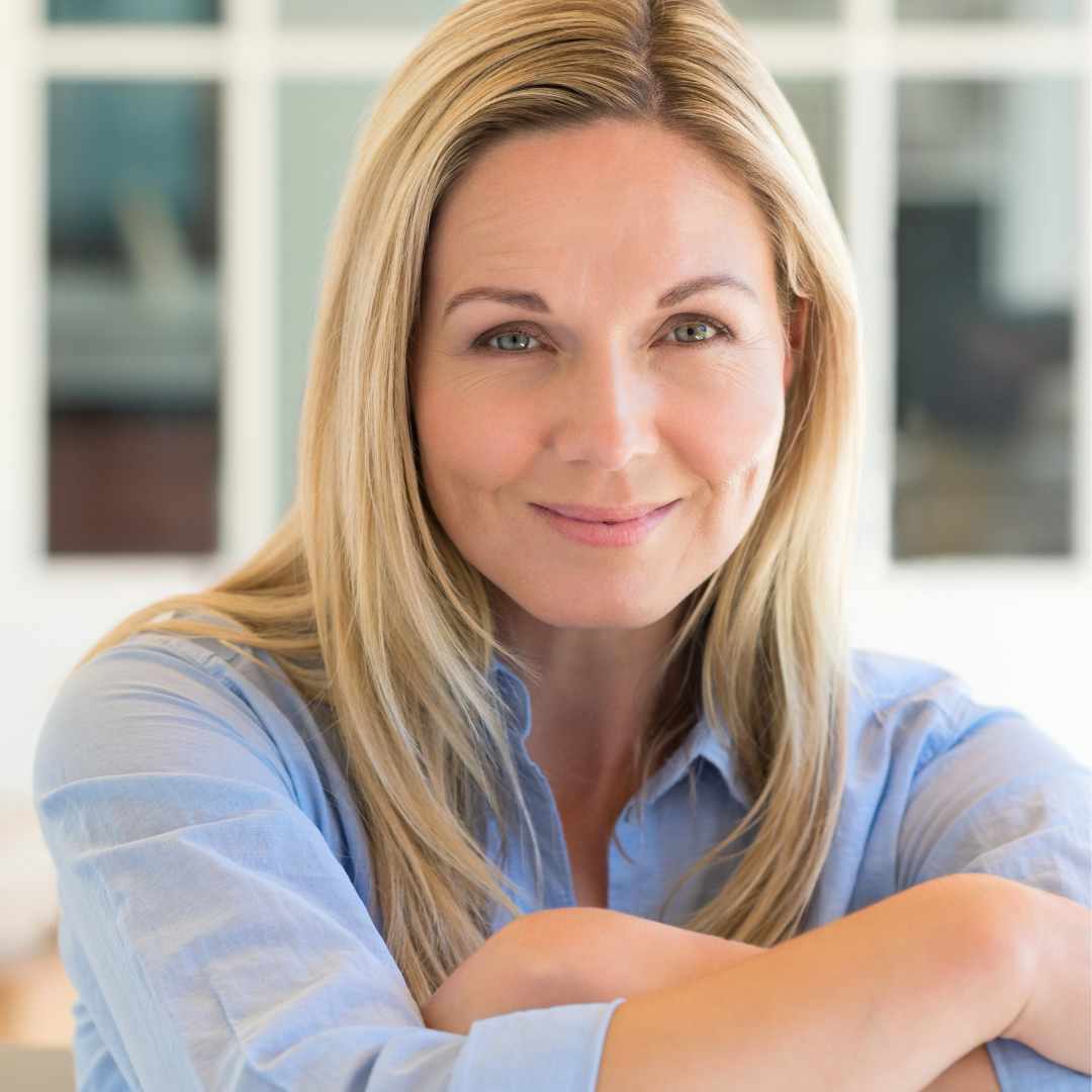 Woman smiling and supporting cellular energy as she ages